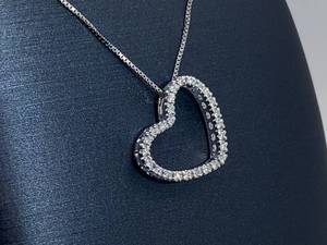 lot 78 image: Gorgeous Diamond Heart Shaped Pendant with Heart Shaped Cutouts on the Sides $1750 Retail