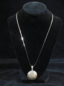 lot 64 image: Large Round Sterling Silver Locket on Herringbone Chain