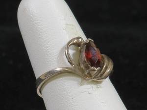 lot 31 image: Sterling Silver Ring with Marquise Cut Garnet Stone
