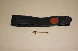 lot 149 image: Fender Tie Clip and a Guitar Strap
