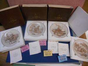 lot 140 image: Set of 4 Collector Plates from the Official Mark Twain Plate Collection Fencing and Charging Knight, Disguising Huck, Traveling the River, and Living Along the River