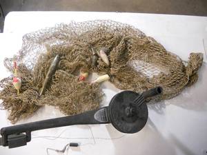 lot 37 image: Great Man cave Display Fishing Net with old lures and bobber and Cannon Fishing Mini-Troll - Easy-Mount DownRigger for smaller boats