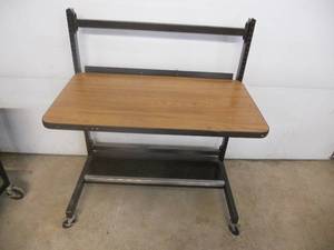 lot 12 image: Shop Desk - Adjustable and with casters Great for your garage