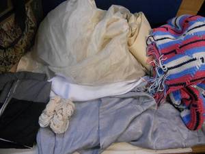 lot 128 image: Taffeta Fabric, White Silky Fabric, Bluish Gray Silky, and More Fabric Material, Lace, Pillow Cases, and Afghan lap throw blanket