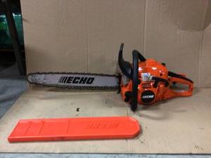 20 in. 50.2 cc Gas 2-Stroke Cycle Chainsaw by ECHO used in working conditions