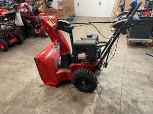 Power Max 824 OE 24 in. 252cc Two-Stage Electric Start Gas Snow Blower by Toro used in working conditions