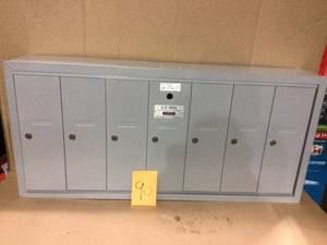 lot 90 image: Aluminum Surface-Mounted USPS Access Vertical Mailbox with 7 Door by Salsbury Industries in good  condition