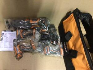 18V Brushless Cordless 4-Tool Combo Kit with (1) 2.0Ah Battery, (1) 4.0 Battery, Charger and Bag by RIDGID in good condition see pictures