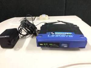 lot 56 image: Linksys WRT54GL Wi-Fi Wireless-G Broadband Router,Blue  Black - Great Working Condition