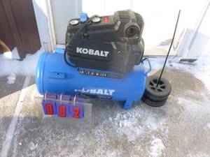 Kobalt 8 gallon air compressor. Nearly new. Is missing handle. Tested & works. As shown.