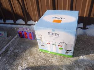Brita under sink water filtration system. Appears new in box. As shown.