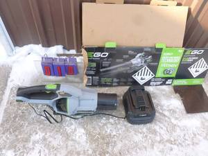 E Go 56 volt blower & charger. No battery or tubes included. As shown.