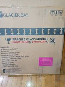 24-38 in. W x 25-14 in. H Frameless Surface-Mount Tri-View Bathroom Medicine Cabinet by Glacier Bay- open box not used
