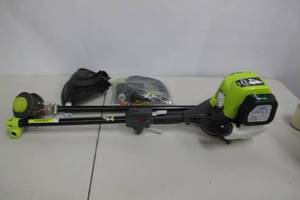lot 45 image: RYOBI-4-Cycle 30cc Attachment Capable Straight Shaft Gas Trimmer .