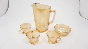 lot 93 image: Vintage Light Orange Glass Flowered Pitcher  3 Flowered Glass Tea Cups  Glass Floral Bowl
