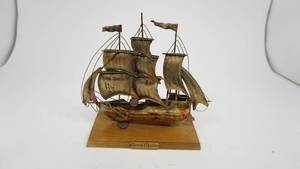 lot 111 image: Metal Santa Maria Ship on Wood Plaque