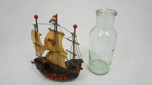 lot 112 image: Vintage Green Glass Milk Bottle  Small Wooden Ship Made in Holland