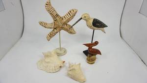 lot 117 image: Wood Carved Tall Shore Bird  Wicker Woven Star Fish  Wood Pelican  2 Large Sea Shells