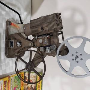 lot 59 image: Keystone 8mm Model K-68 Projector with Disney Movies