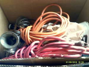 box of misc extension cords and mea...
