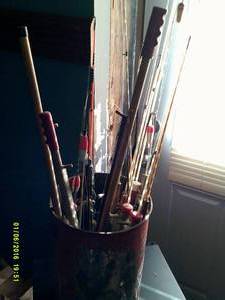 bucket of ice fishing poles ...
