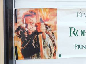 lot 55 image: Vintage 1991 Robin Hood Prince of Thieves Movie Theater Banner
