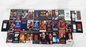lot 103 image: Lot of 34 Vintage VHS Movies - Most Are Promotional Screening Tapes - Mainly Action Movies
