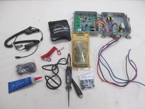 lot 187 image: Phone chargers, trailer wiring, tire repair kit, combo switch