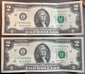 lot 33 image: Two Crisp 2013 $2 Bills - L72768103A & L72768104A
