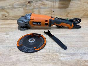 lot 34 image: RIDGID 15 Amp Corded 7 in. Twist Handle Angle Grinder