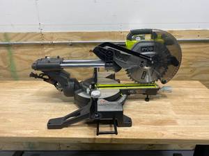 lot 86 image: RYOBI 15 Amp 10 in. Sliding Compound Miter Saw with LED