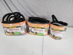 lot 137 image: 3 Expandable Garden Hoses