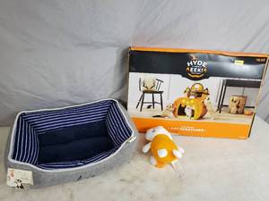 lot 212 image: New Ellen Degeneres Pet Bed, New Toy, and New Scratcher