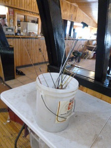 lot 84 image: Bucket of Ice Fishing Poles