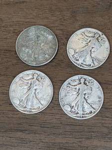 lot 125 image: Four Walking Liberty Silver Half Dollars