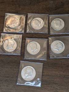 lot 132 image: Seven 1967 Kennedy Silver Half Dollars