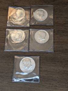 lot 135 image: Five Kennedy Silver Half Dollars