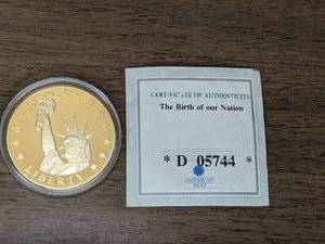 lot 136 image: American Mint CommemorativeStatue of Liberty Coin The Birth of Our Nation