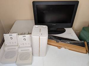 lot 169 image: 20 Dynex TV, Portable Speakers & Keyboard