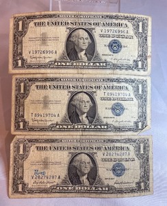 Three Silver Certificates - $1 - V 28274287 A, T 89419704 A, V 19726996 A