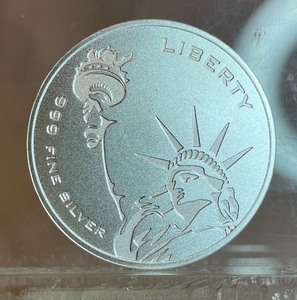 One Troy Ounce Silver Round -