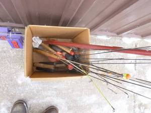 Box of ice fishing poles. As shown.