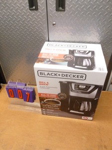 Black & Decker coffee makergrinder. Appears new in box. As shown.
