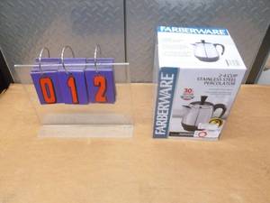 Farberware 2 - 4 cup stainless coffee maker. Appears new in box. As shown.