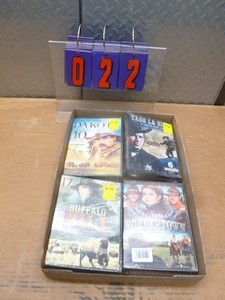 Flat of mostly western dvds. As shown.