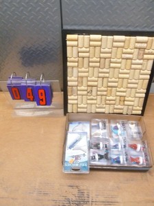 Bottle cork tray & bottle stoppers. As shown.