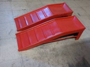 lot 106 image: pair of red metal ramps...