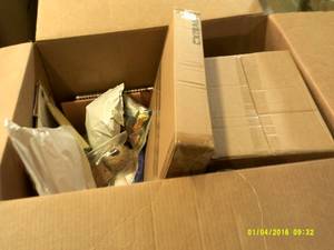 box of gift bags and party supplies...