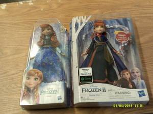 2 frozen anna dolls...