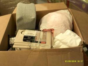 box full of curtains and blankets a...